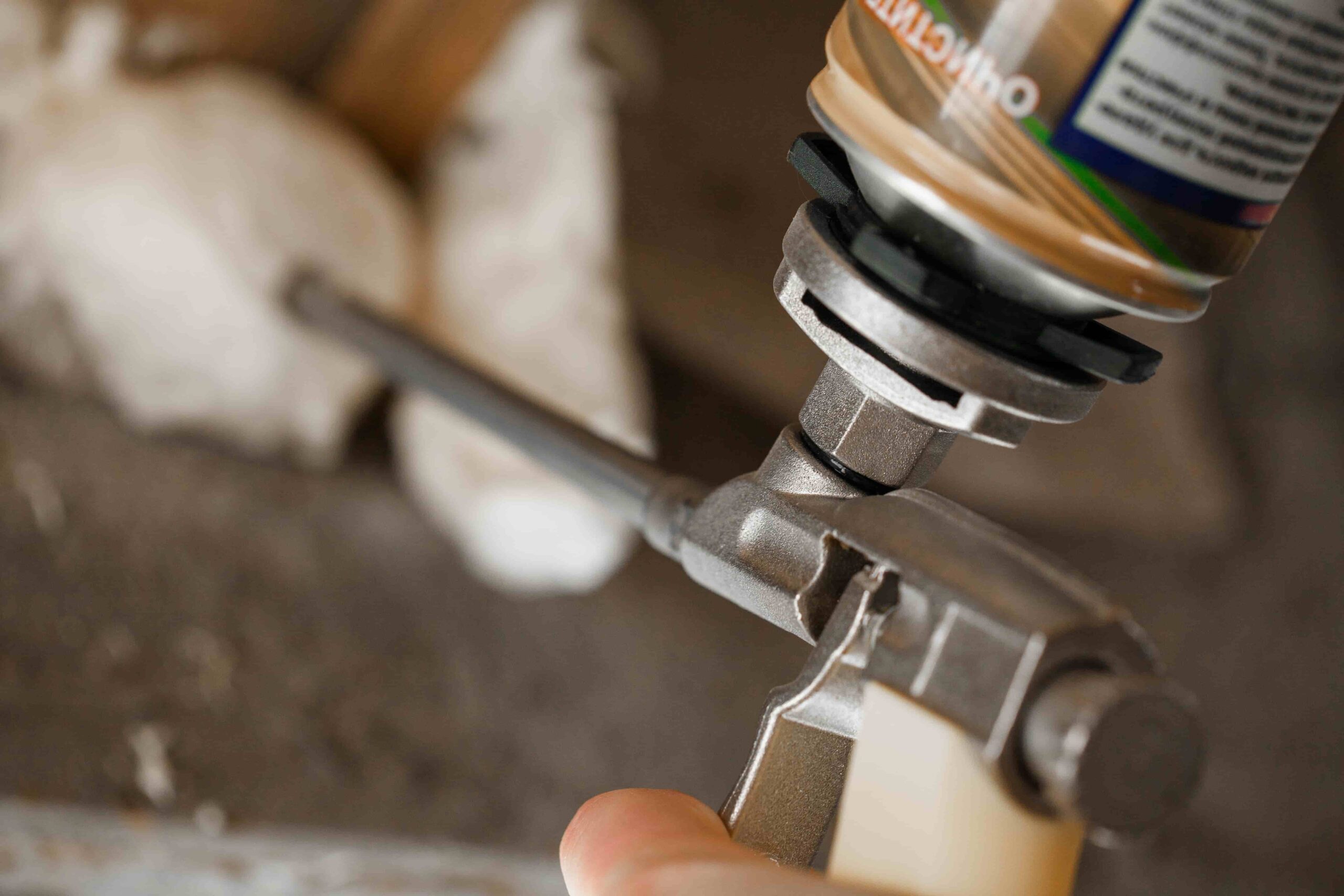 A plumber repairing a sump pump in a flooded basement